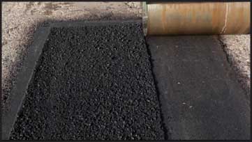 part of an asphalt patch compacted