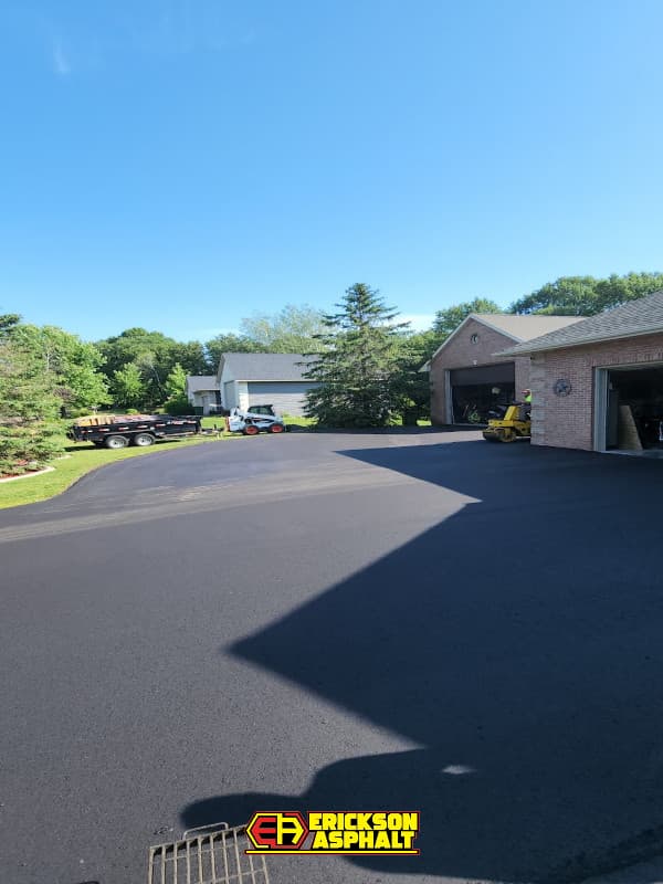 detached garage with newly paved driveway