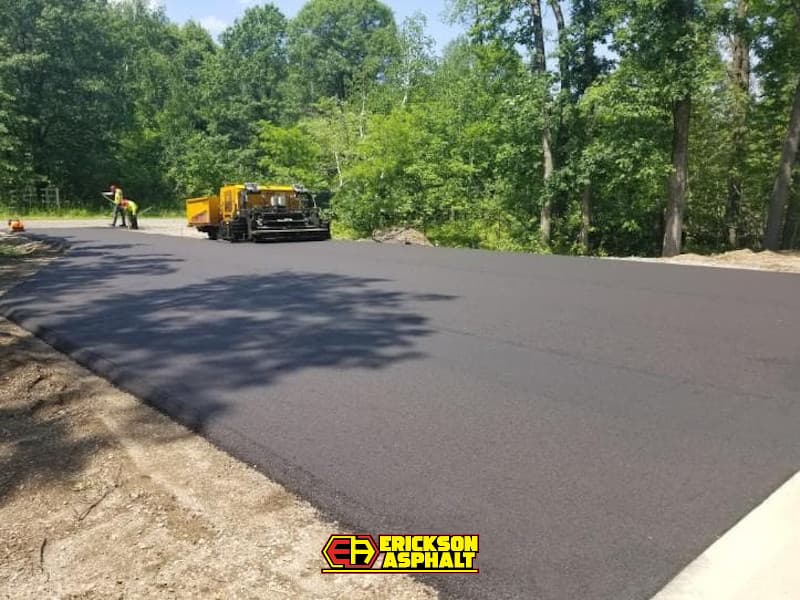 paver laying asphalt in a parking lot