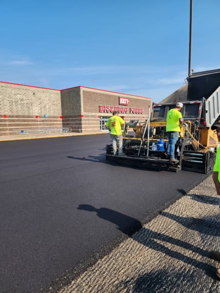 crew installing hot mix asphalt