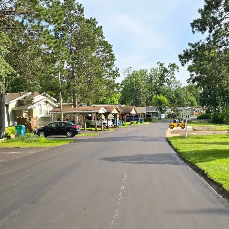 Final road paved at Pine Village