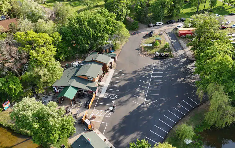 Areal view of a new asphalt parking lot.
