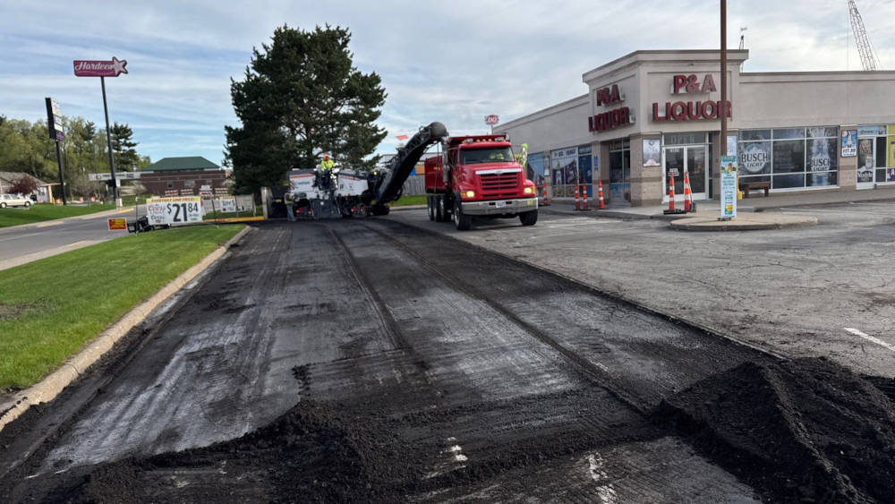asphalt being milled from a parking lot