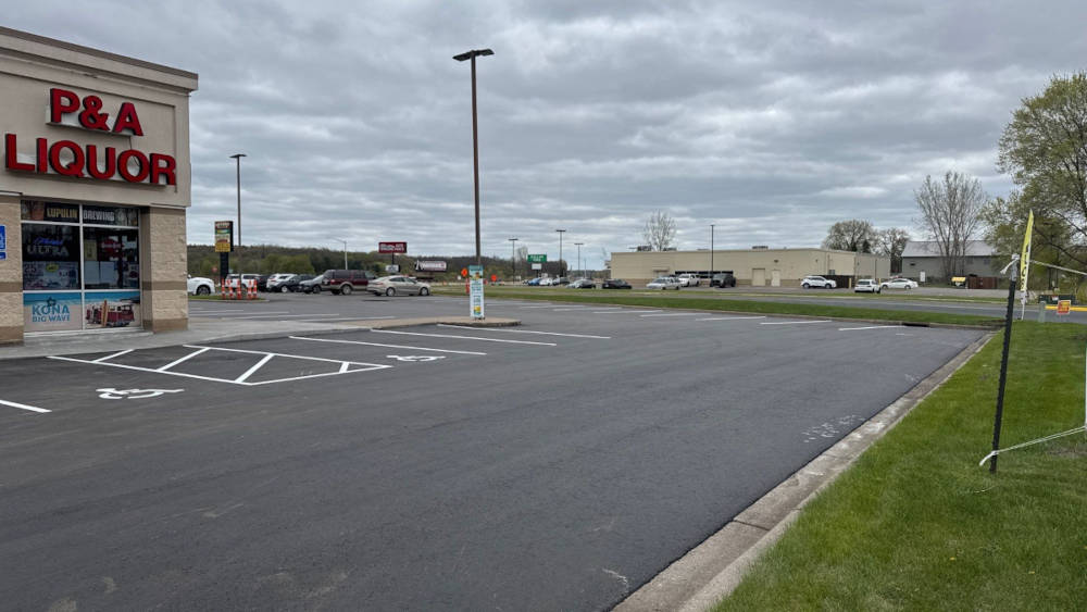 Final view of parking lot with asphalt overlay and new striping