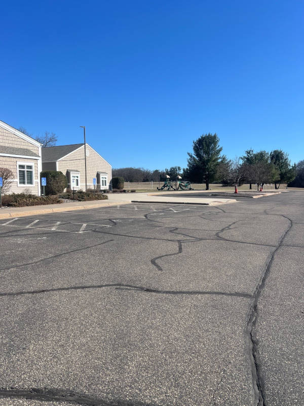 Asphalt parking lot without sealcoating