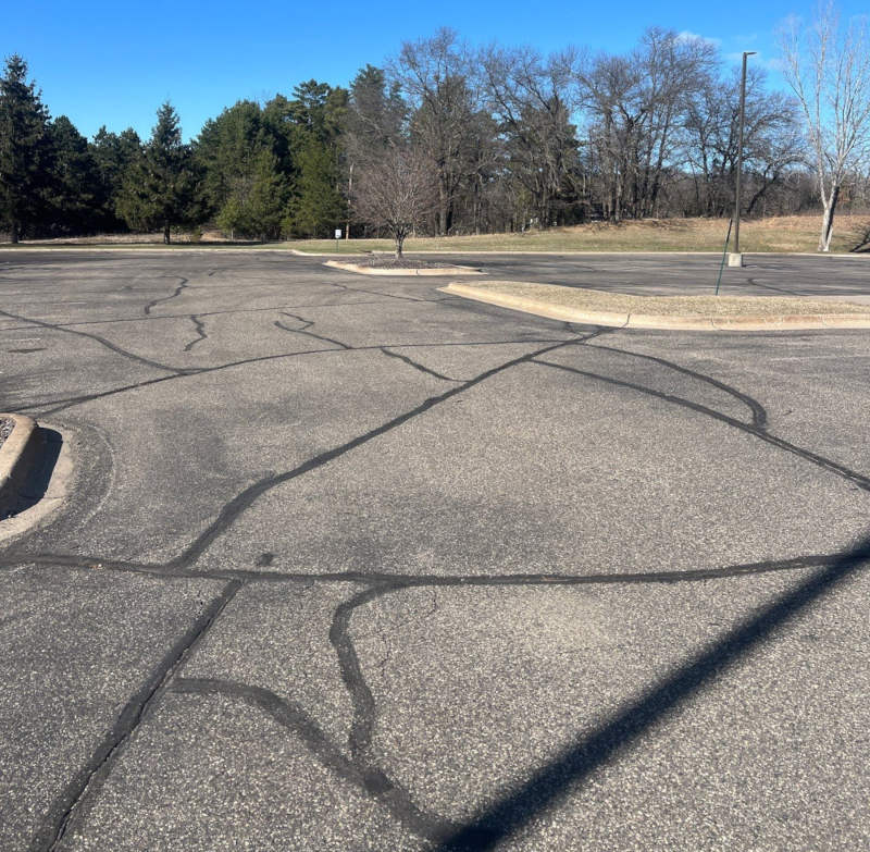 Photo of parking lot before sealcoating
