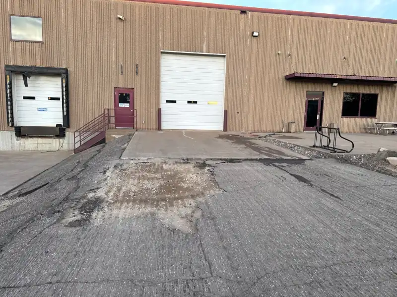 loading dock area where the asphalt has been milled and ready for new HMA to be installed